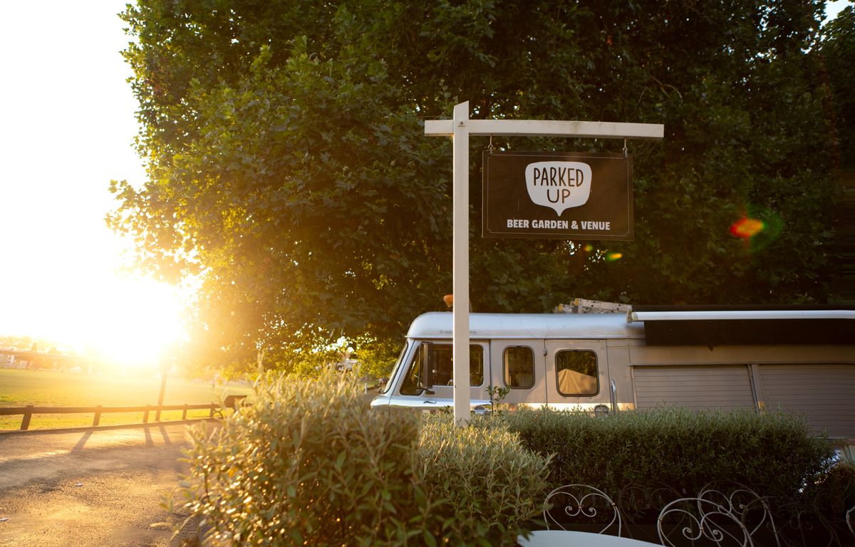 Parked Up venue signage at golden hour